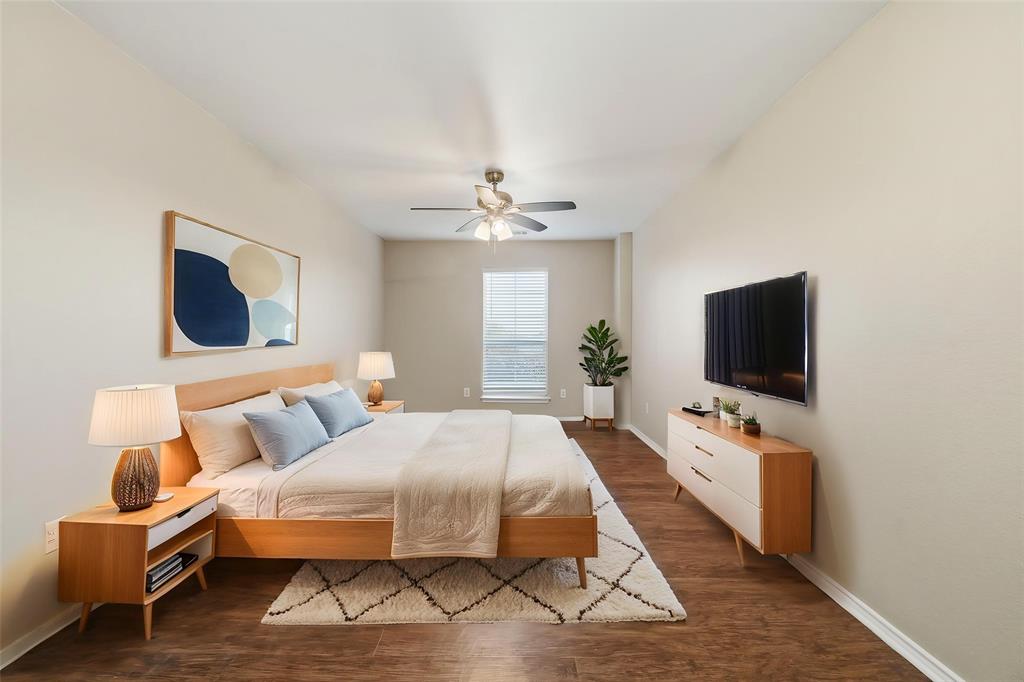 111 Maned Drive Sanger, TX 76266 - Photo 8 of 40 a bedroom with a bed and a flat screen tv