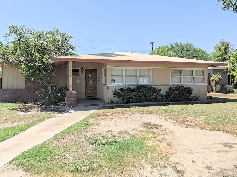 82181 Miles Avenue Indio, CA 92201 - Photo 2 of 21 a front view of a house with garden