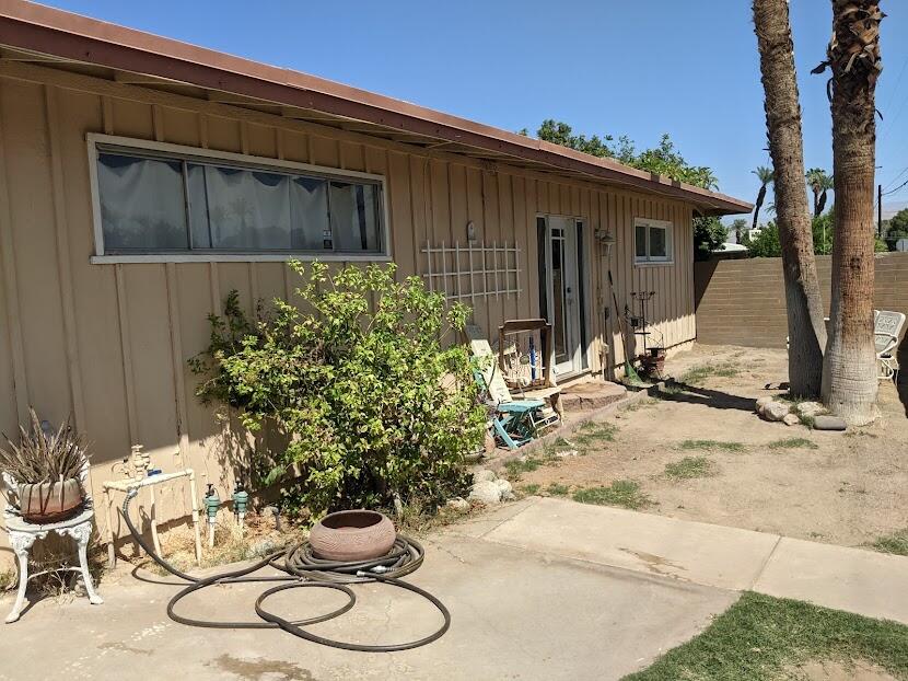 82181 Miles Avenue Indio, CA 92201 - Photo 14 of 21 a backyard of a house with table and chairs