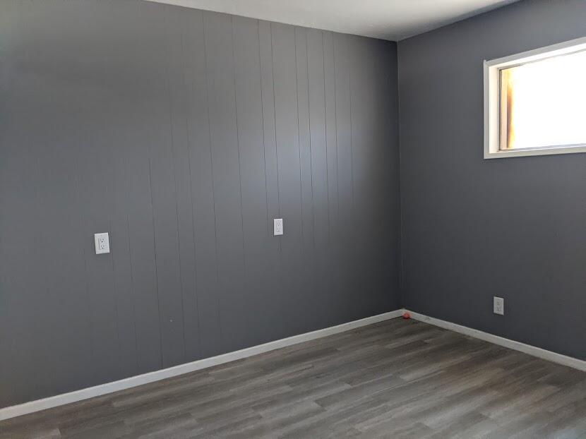 82181 Miles Avenue Indio, CA 92201 - Photo 16 of 21 a view of an empty room with wooden floor and a window