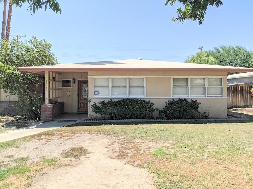 82181 Miles Avenue Indio, CA 92201 - Photo 3 of 21 a view of house with backyard and garden