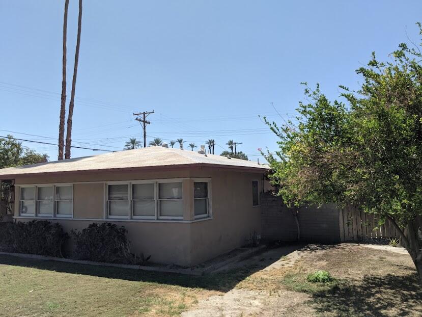 82181 Miles Avenue Indio, CA 92201 - Photo 4 of 21 a front view of a house with a yard