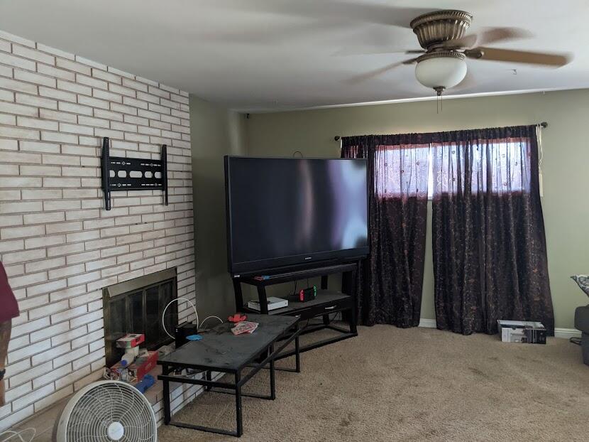 82181 Miles Avenue Indio, CA 92201 - Photo 5 of 21 a living room with furniture and a flat screen tv