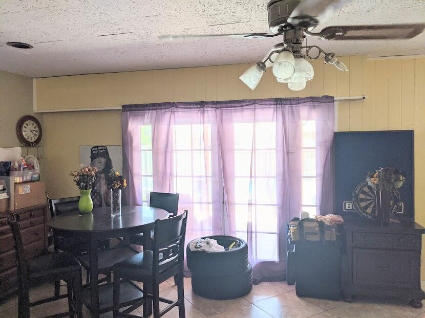 82181 Miles Avenue Indio, CA 92201 - Photo 9 of 21 a dining room with furniture and window
