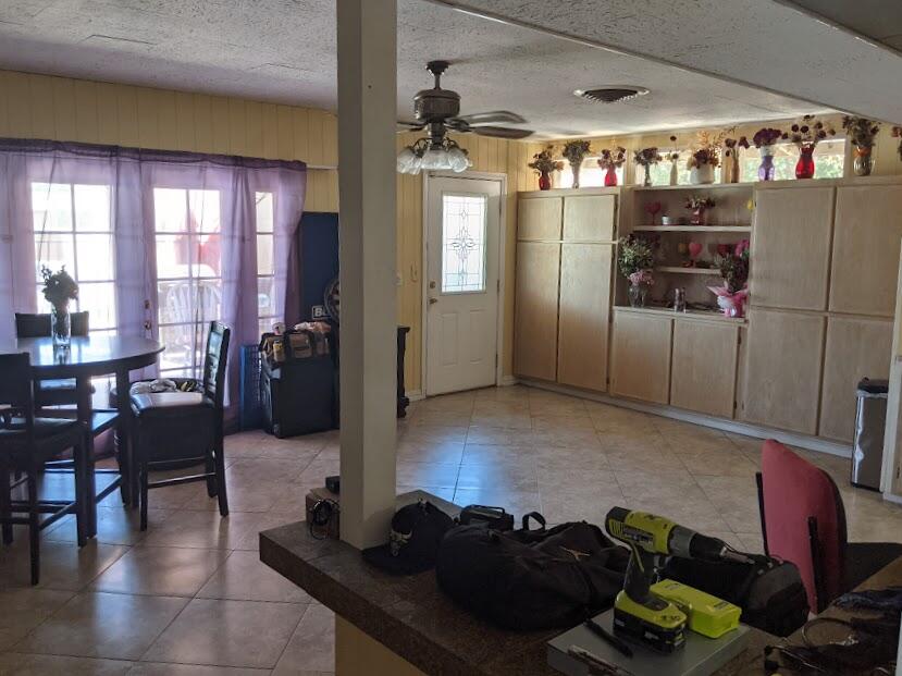 82181 Miles Avenue Indio, CA 92201 - Photo 10 of 21 a living room with furniture and a chandelier