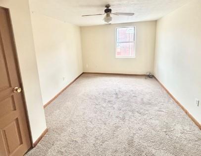 40 Race Street, Unit 2D Manor, PA 15665 - Photo 7 of 9 an empty room with a window and fireplace