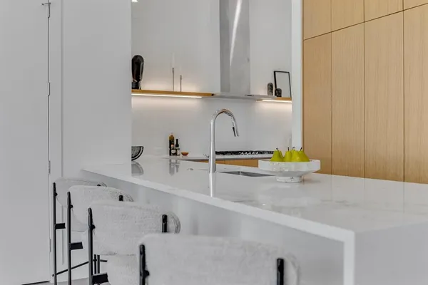 a view of a kitchen with appliances and cabinets