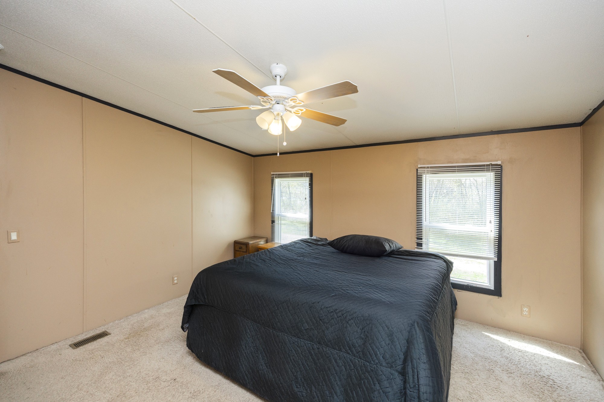 8591 Lowe Christiana Road Christiana, TN 37037 - Photo 18 of 37 a bedroom with a bed and a chandelier