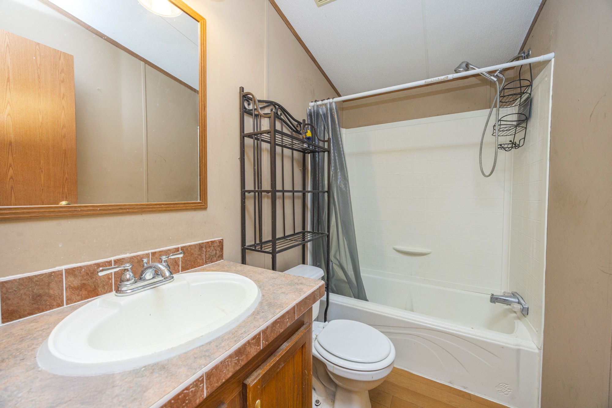 8591 Lowe Christiana Road Christiana, TN 37037 - Photo 22 of 37 a bathroom with a sink toilet and shower