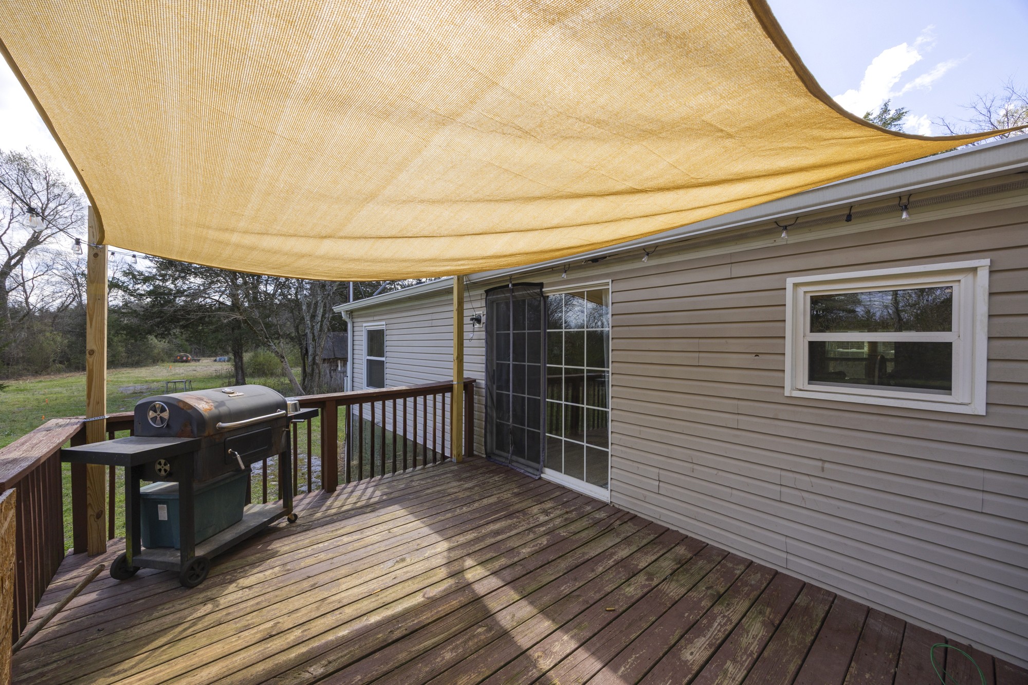 8591 Lowe Christiana Road Christiana, TN 37037 - Photo 27 of 37 a view of a deck with wooden floor and fence