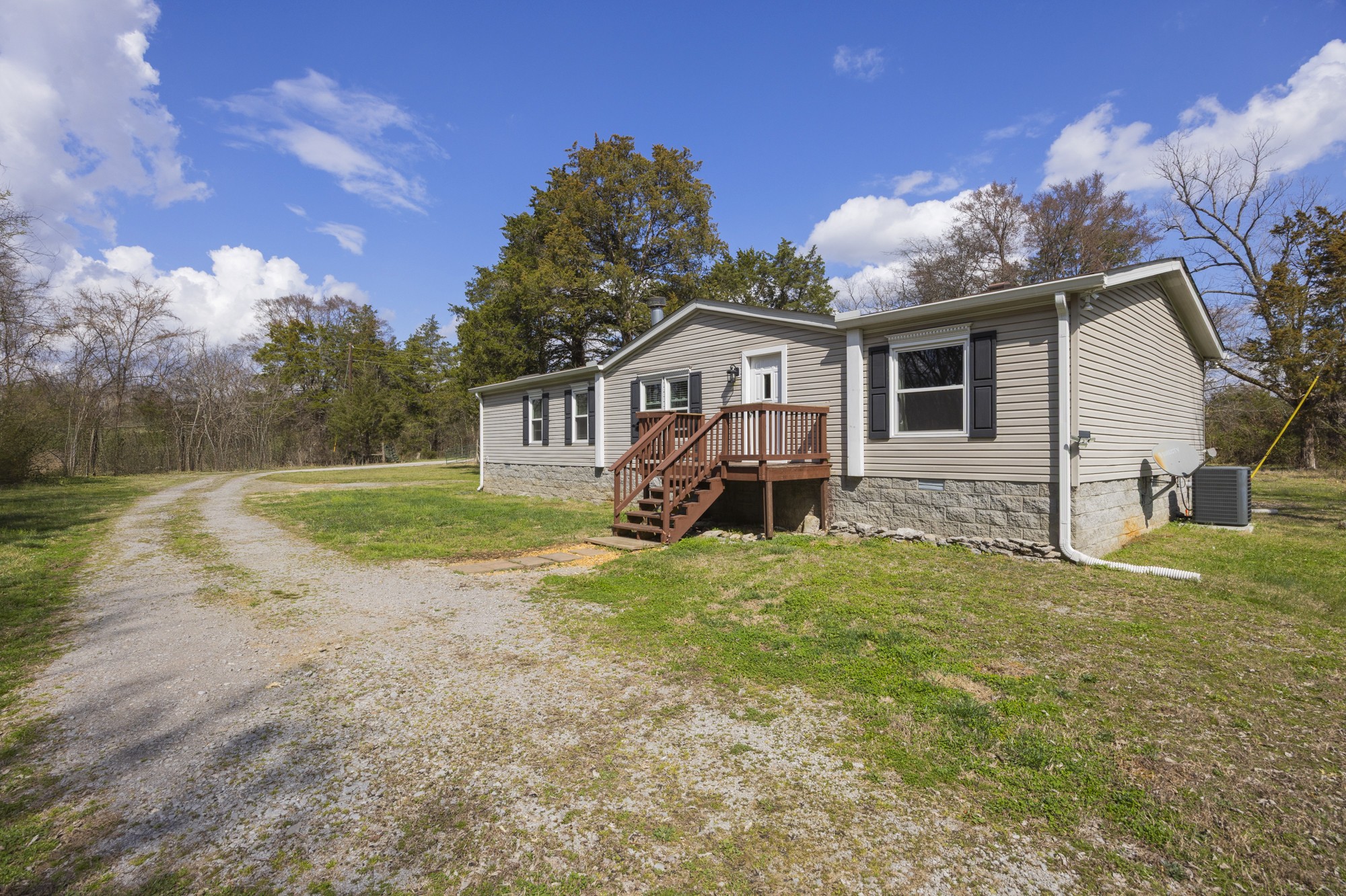 8591 Lowe Christiana Road Christiana, TN 37037 - Photo 28 of 37 a front view of a house with a yard and garage