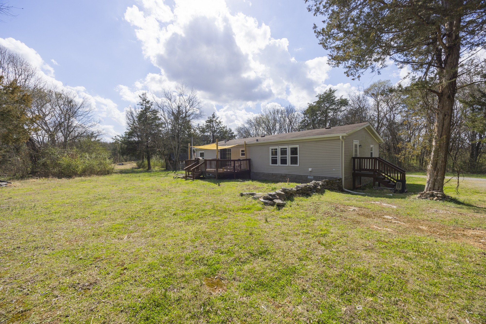 8591 Lowe Christiana Road Christiana, TN 37037 - Photo 29 of 37 a house view with swimming pool in front of it