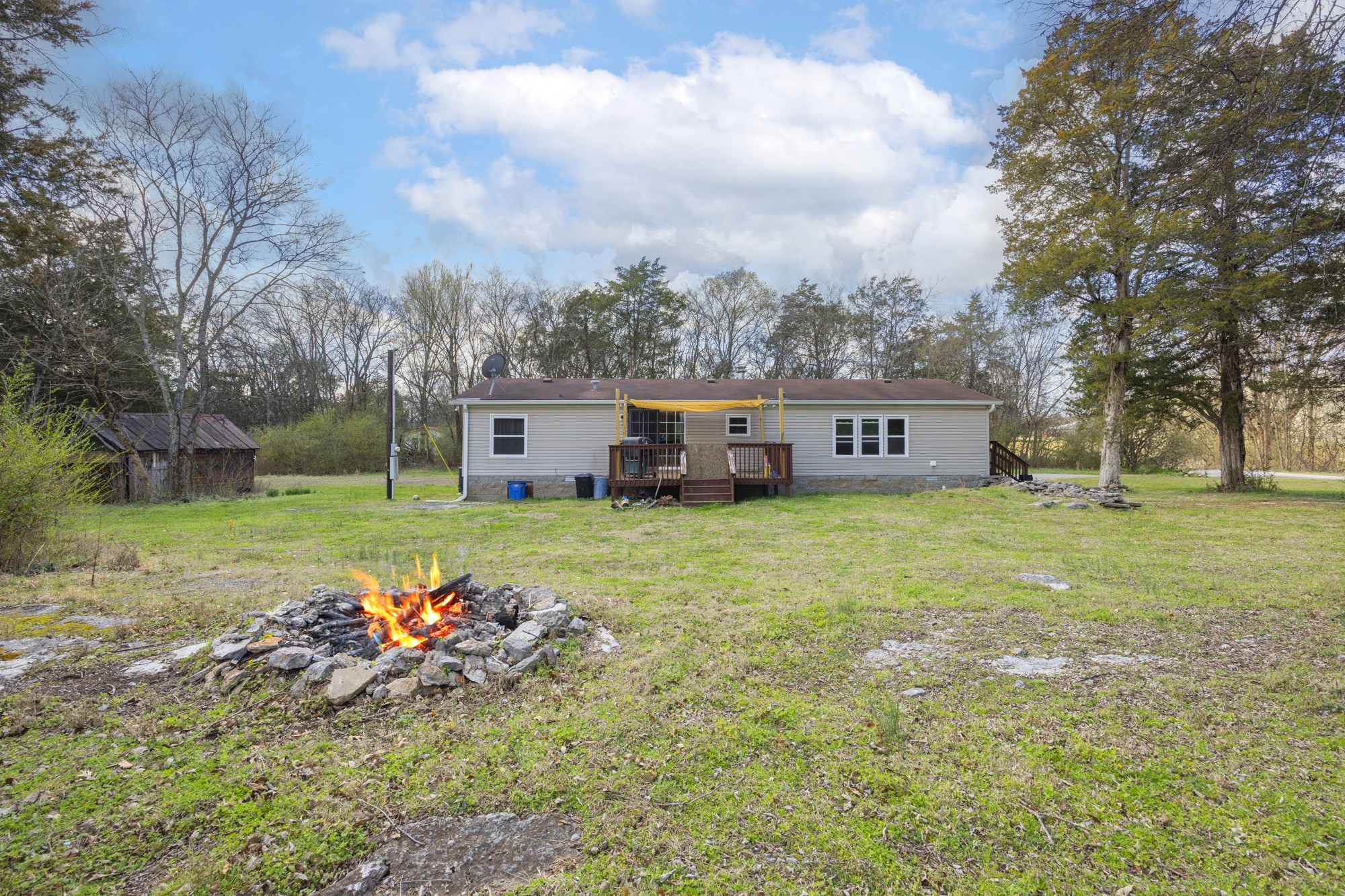 8591 Lowe Christiana Road Christiana, TN 37037 - Photo 30 of 37 a view of a house with a yard