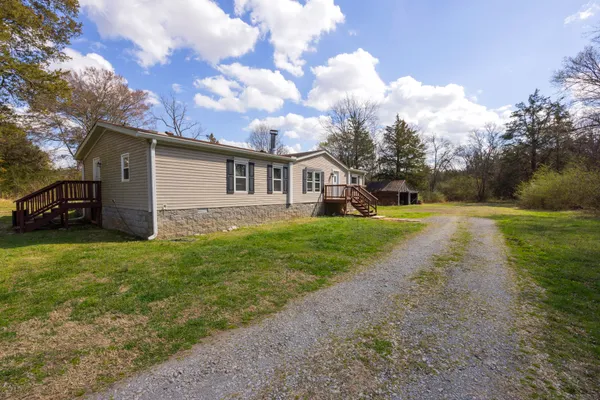 a view of a house with a back yard
