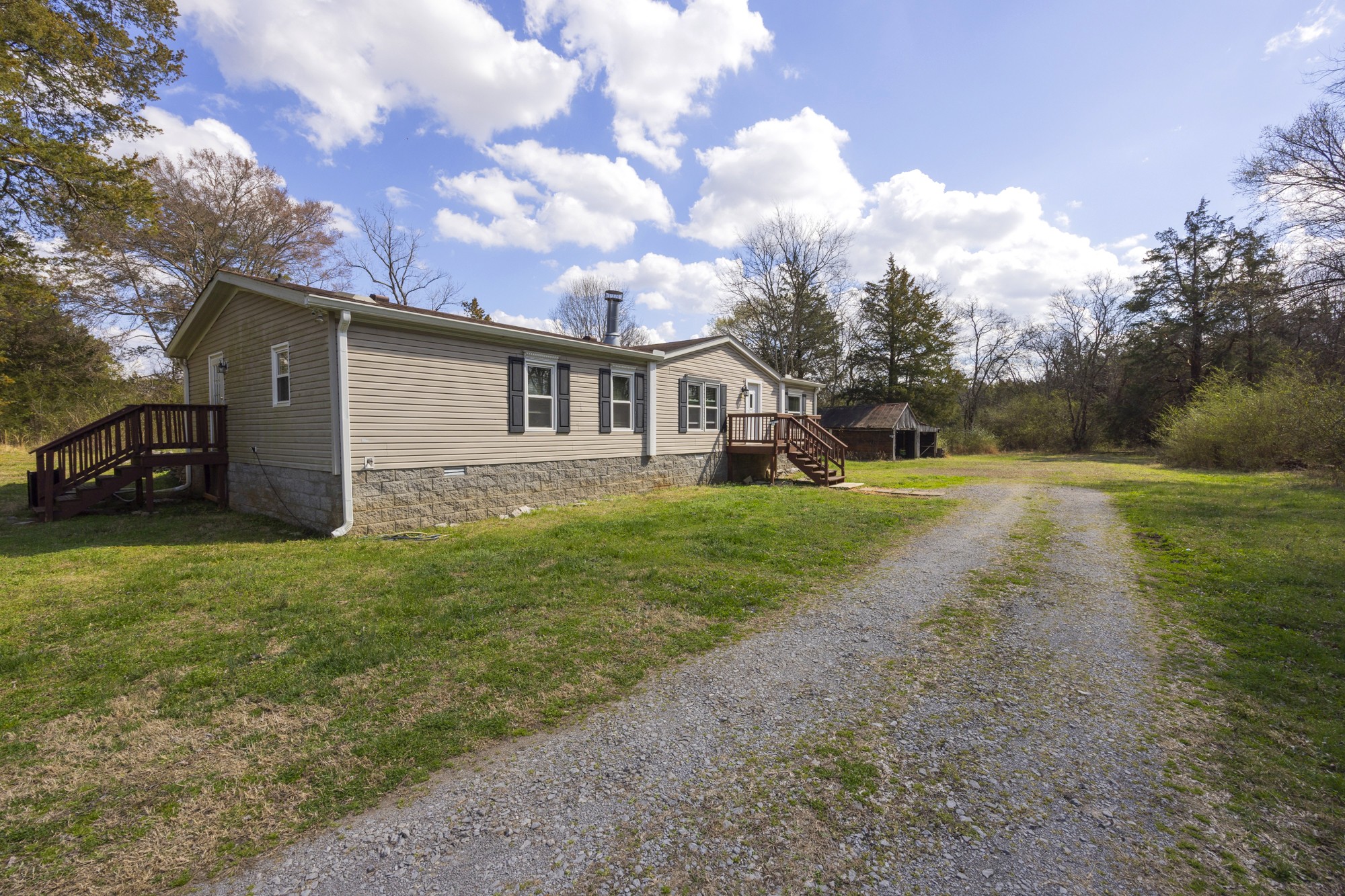 8591 Lowe Christiana Road Christiana, TN 37037 - Photo 3 of 37 a view of a house with a back yard