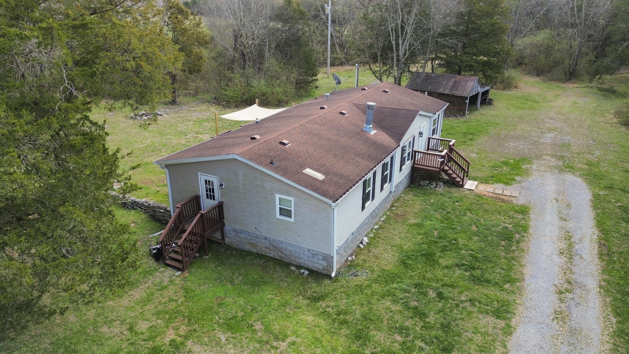 8591 Lowe Christiana Road Christiana, TN 37037 - Photo 32 of 37 an aerial view of a house with backyard