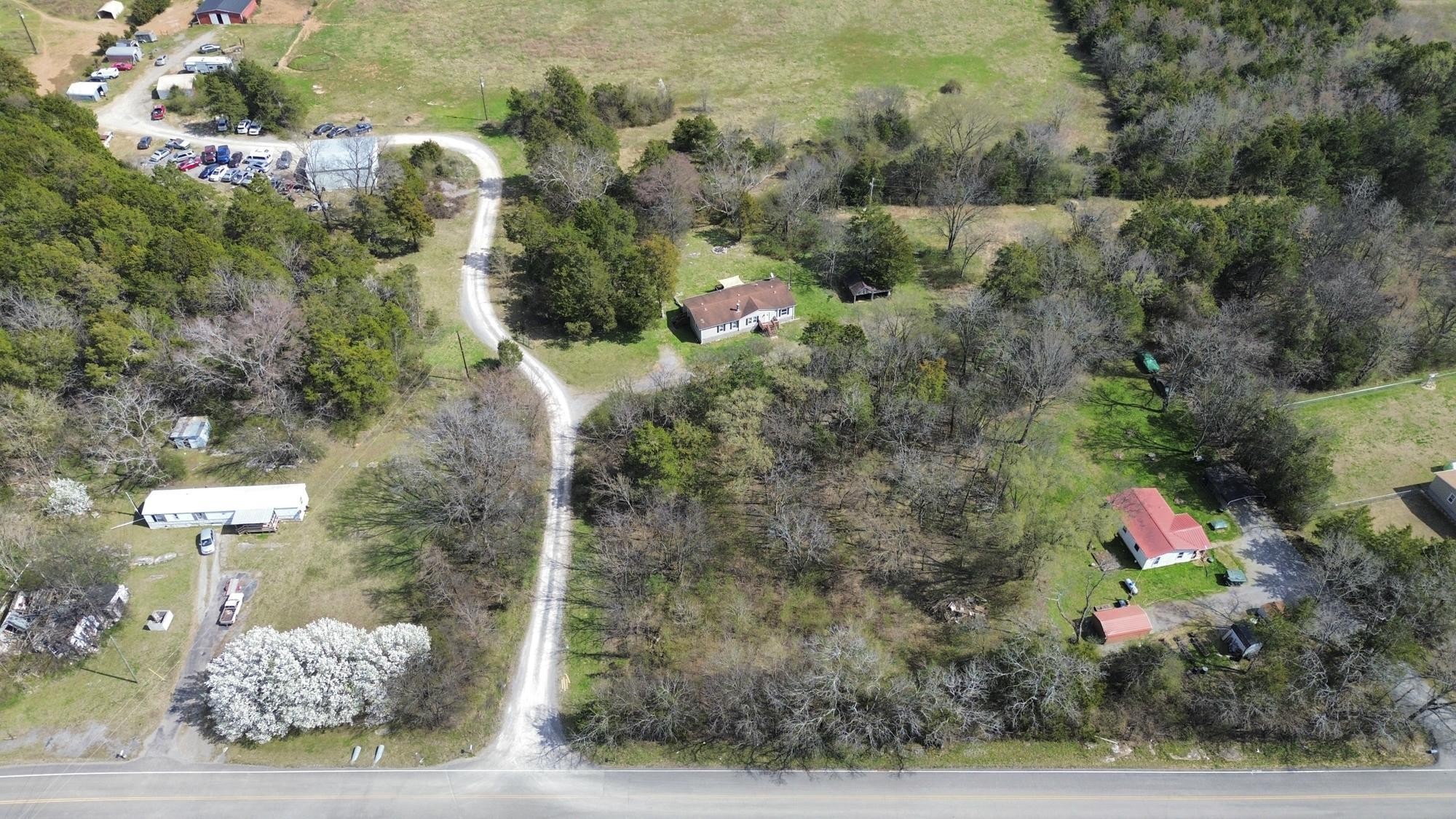 8591 Lowe Christiana Road Christiana, TN 37037 - Photo 34 of 37 an aerial view of residential house with outdoor space and trees