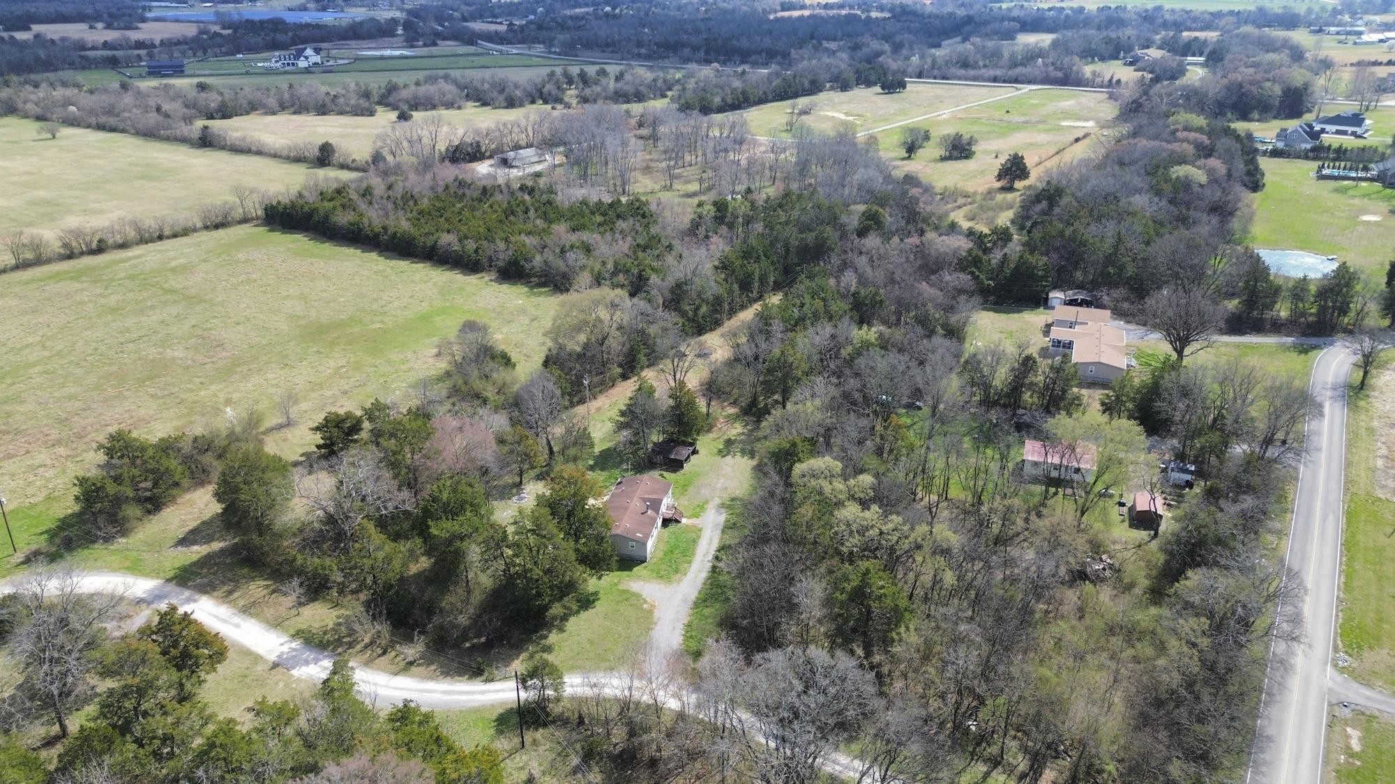 8591 Lowe Christiana Road Christiana, TN 37037 - Photo 36 of 37 a view of a lake in middle of the forest