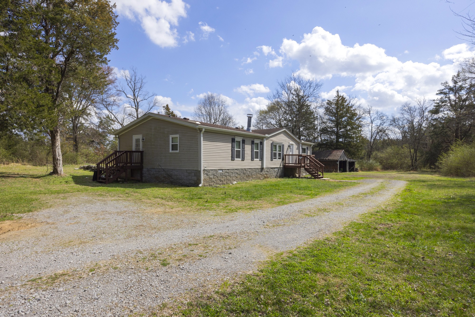 8591 Lowe Christiana Road Christiana, TN 37037 - Photo 4 of 37 a view of house with backyard