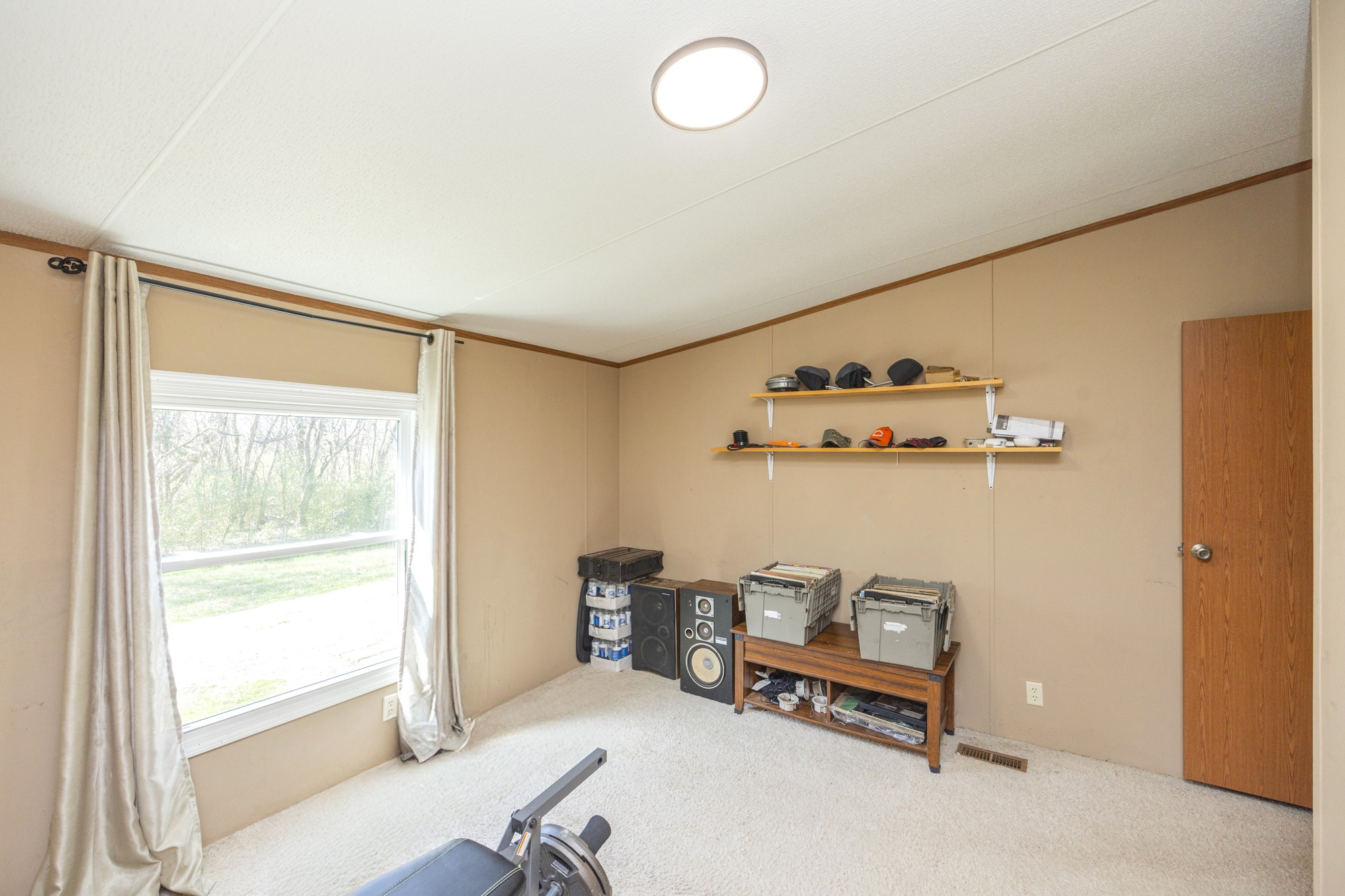 8591 Lowe Christiana Road Christiana, TN 37037 - Photo 8 of 37 a bedroom with furniture and a window