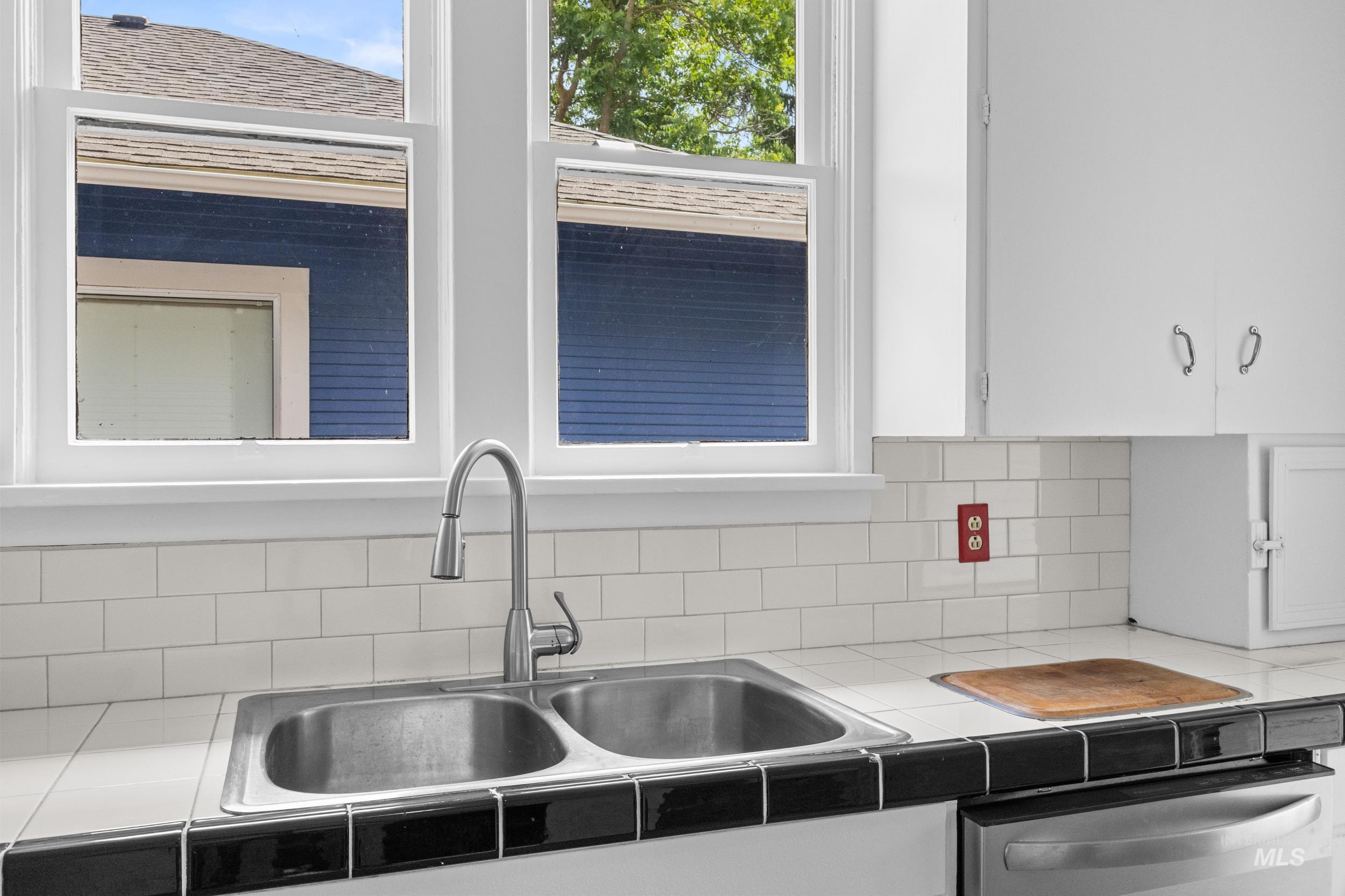 2119 West Brumback Street Boise, ID 83702 - Photo 14 of 30 Kitchen area featuring a stainless steel double basin sink with a gooseneck faucet
