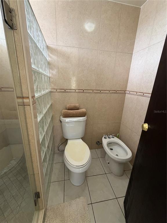 1 St Rio Grande, Unit B6 Rio Grande, PR 00745 - Photo 34 of 47 a white toilet sitting next to a wooden floor