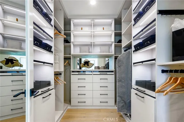 a kitchen with stainless steel appliances a refrigerator and a stove