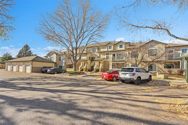 a front view of residential houses with yard