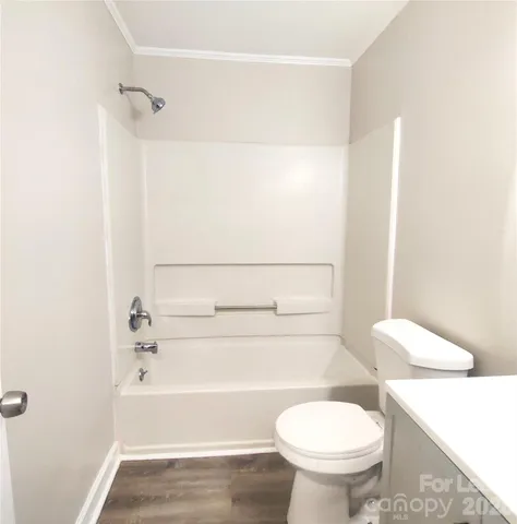 a bathroom with a toilet and a bathtub