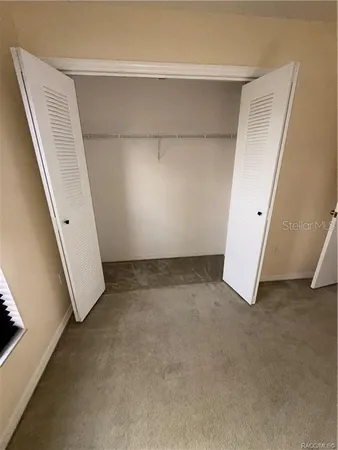 an empty room with a stairs