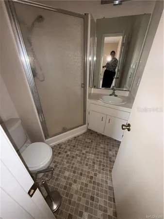 a bathroom with a sink and mirror