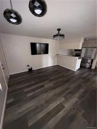 a view of a livingroom with furniture and wooden floor