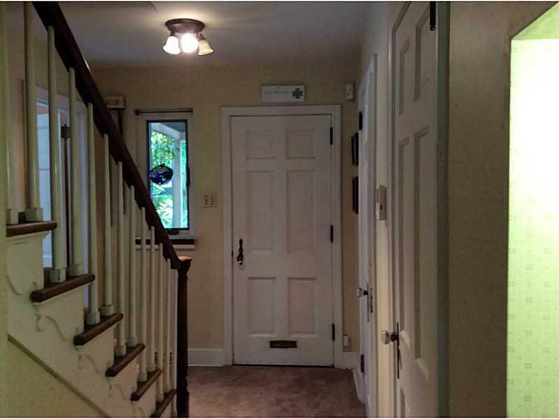 Entry/Foyer. Beautiful entry, newly carpeted. Window looking out to front porch Old fashioned telephone cubby. Coat closet and powder room.