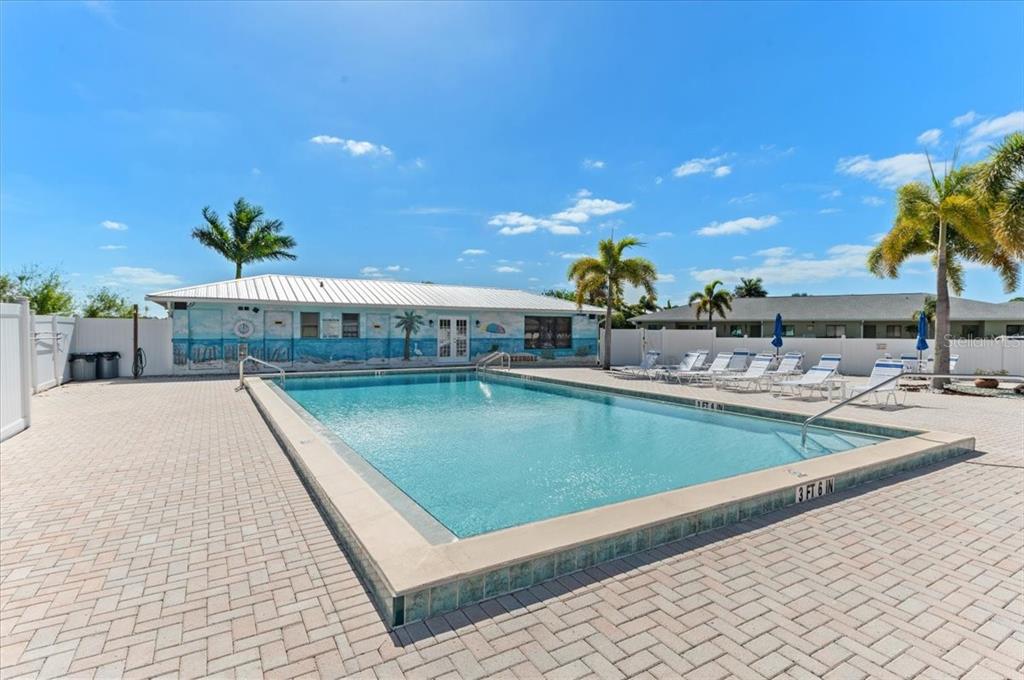 25225 Rampart Boulevard, Unit 1207 Punta Gorda, FL 33983 - Photo 31 of 40 a view of a swimming pool with outdoor seating