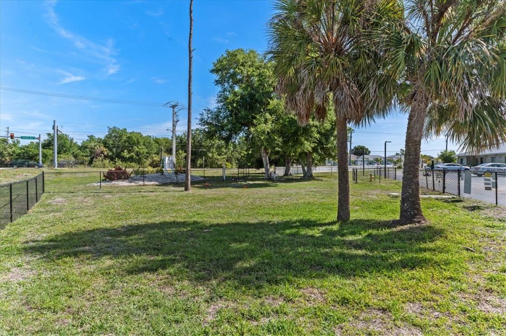 25225 Rampart Boulevard, Unit 1207 Punta Gorda, FL 33983 - Photo 34 of 40 a garden with trees
