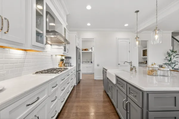 a bathroom with a double vanity sink a mirror and a bathtub