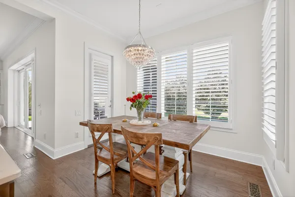 a spacious bedroom with a bed and ceiling fan