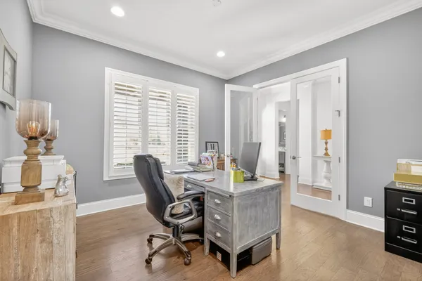 a backyard of a house with outdoor seating