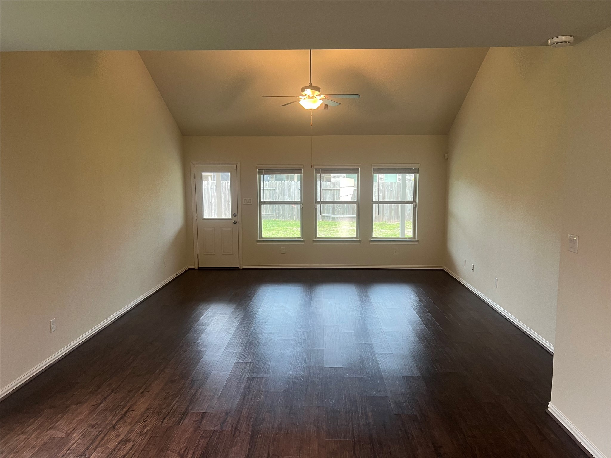 4706 Walnut Willow Ct Spring Spring, TX 77386 - Photo 16 of 17 a view of an empty room with wooden floor and a window
