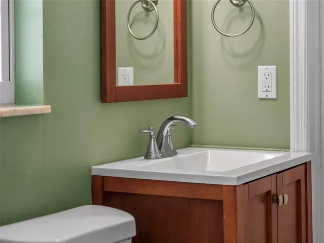 a hallway with a couch and dresser