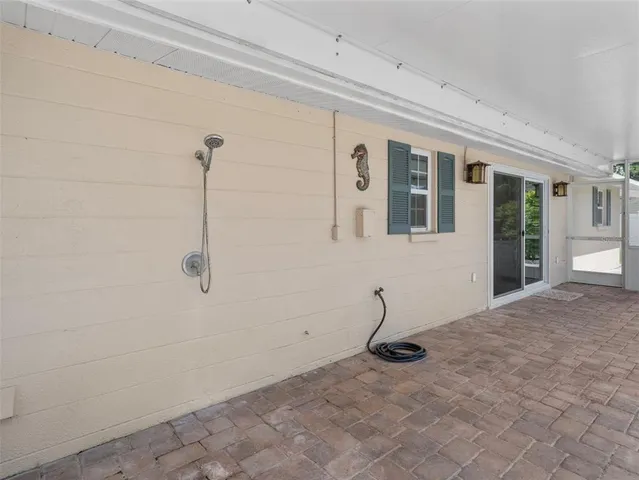 a view of a backyard with sitting area