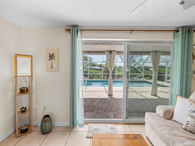 a view of a glass door with a yard