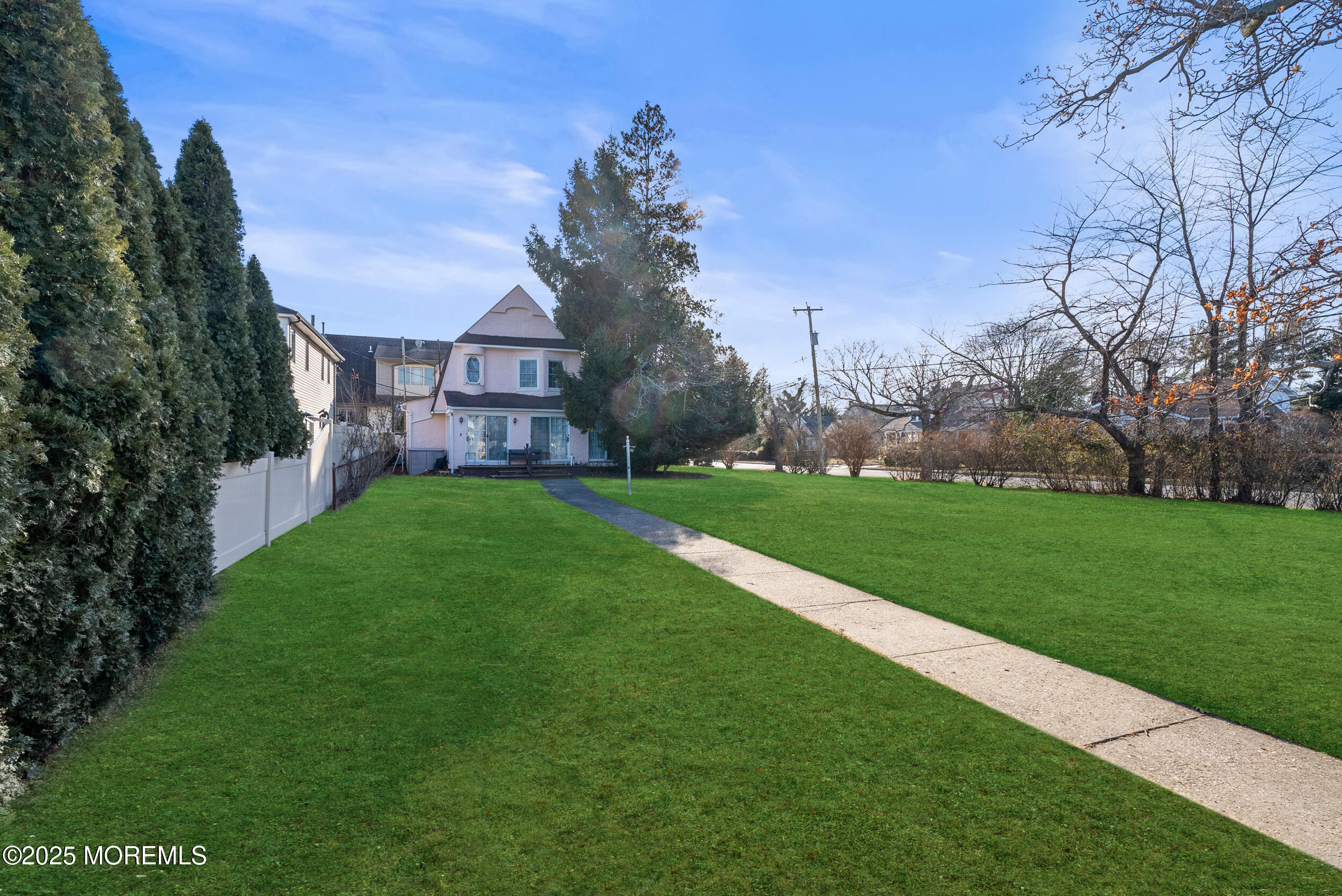 90 Deal Esplanade Deal, NJ 07723 - Photo 1 of 25 a view of a big house with a big yard and large trees