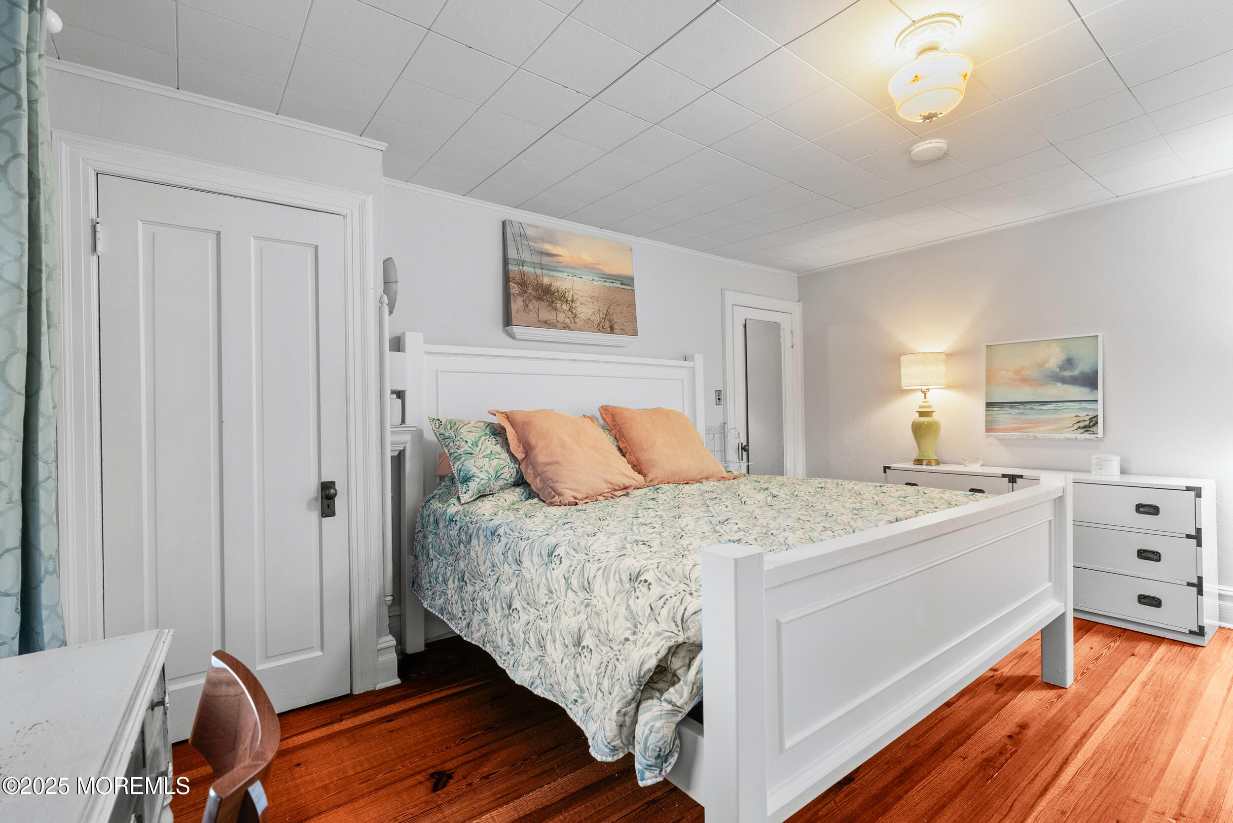 90 Deal Esplanade Deal, NJ 07723 - Photo 15 of 25 a bed room with a bed and a dresser