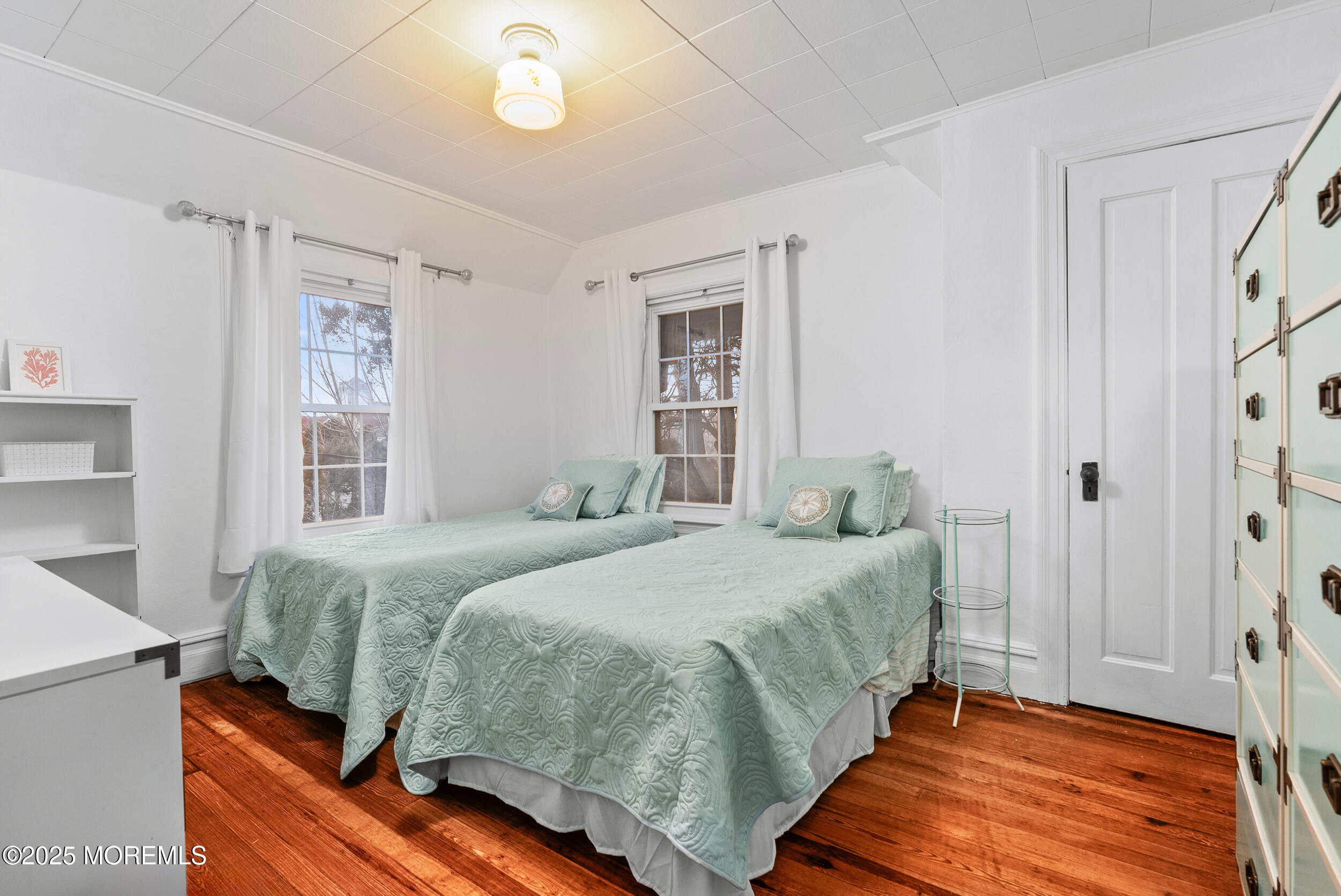 90 Deal Esplanade Deal, NJ 07723 - Photo 17 of 25 a bedroom with a bed and a window