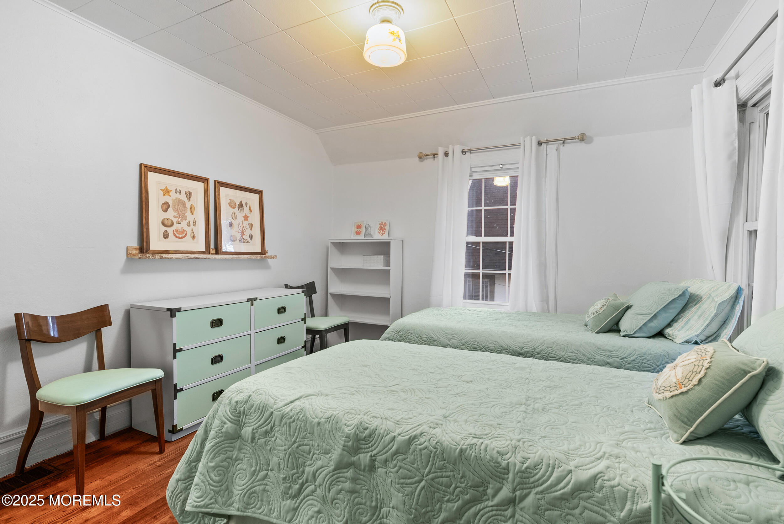 90 Deal Esplanade Deal, NJ 07723 - Photo 18 of 25 a bedroom with a bed and a window