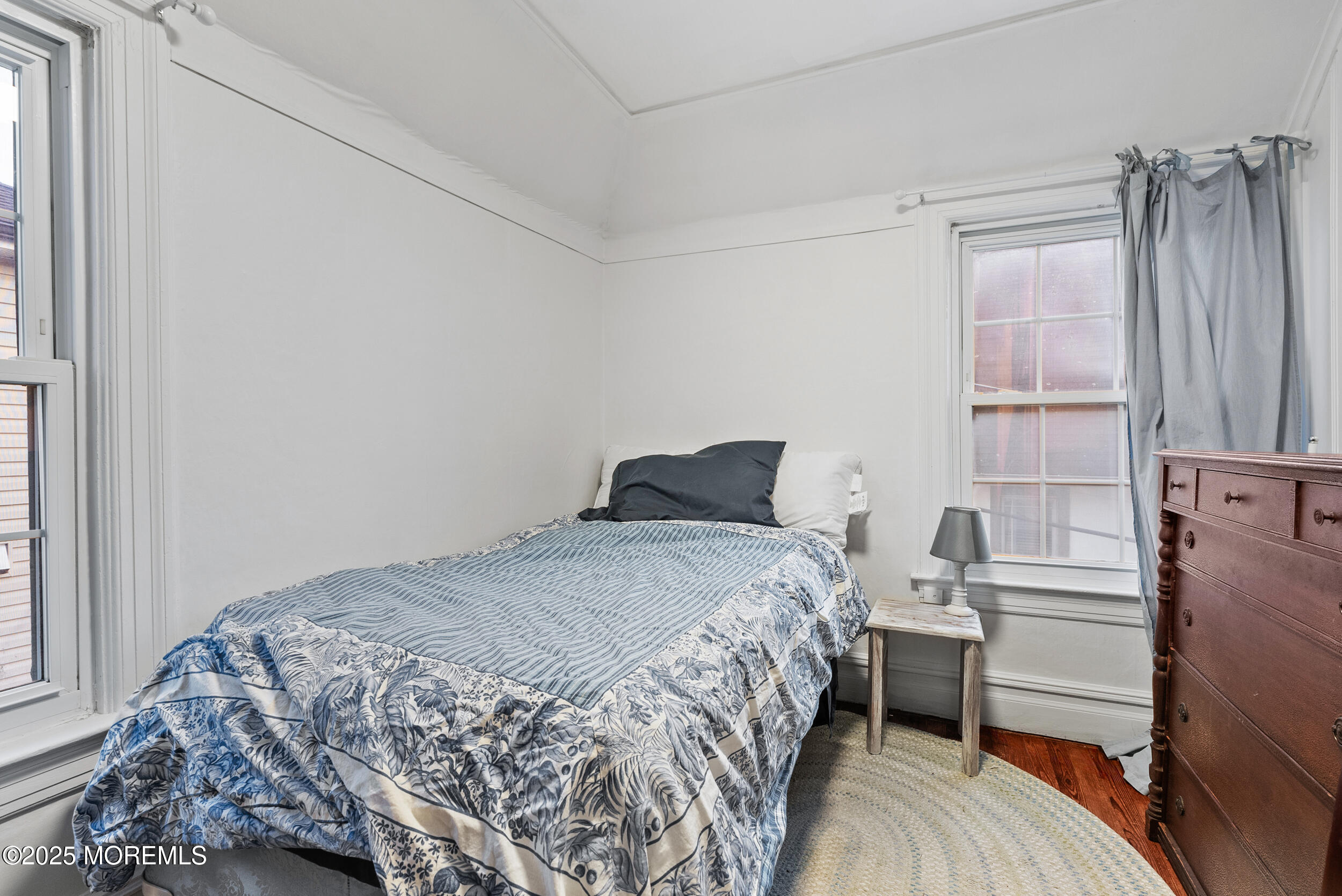90 Deal Esplanade Deal, NJ 07723 - Photo 19 of 25 a bedroom with a bed and a window
