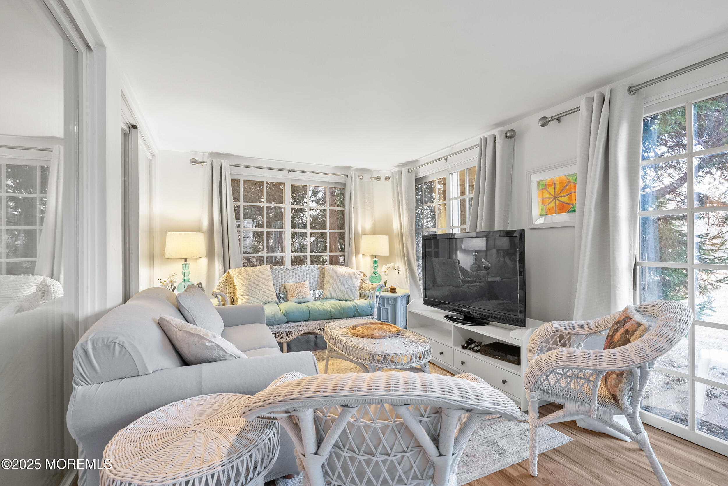 90 Deal Esplanade Deal, NJ 07723 - Photo 21 of 25 a living room with furniture and a flat screen tv