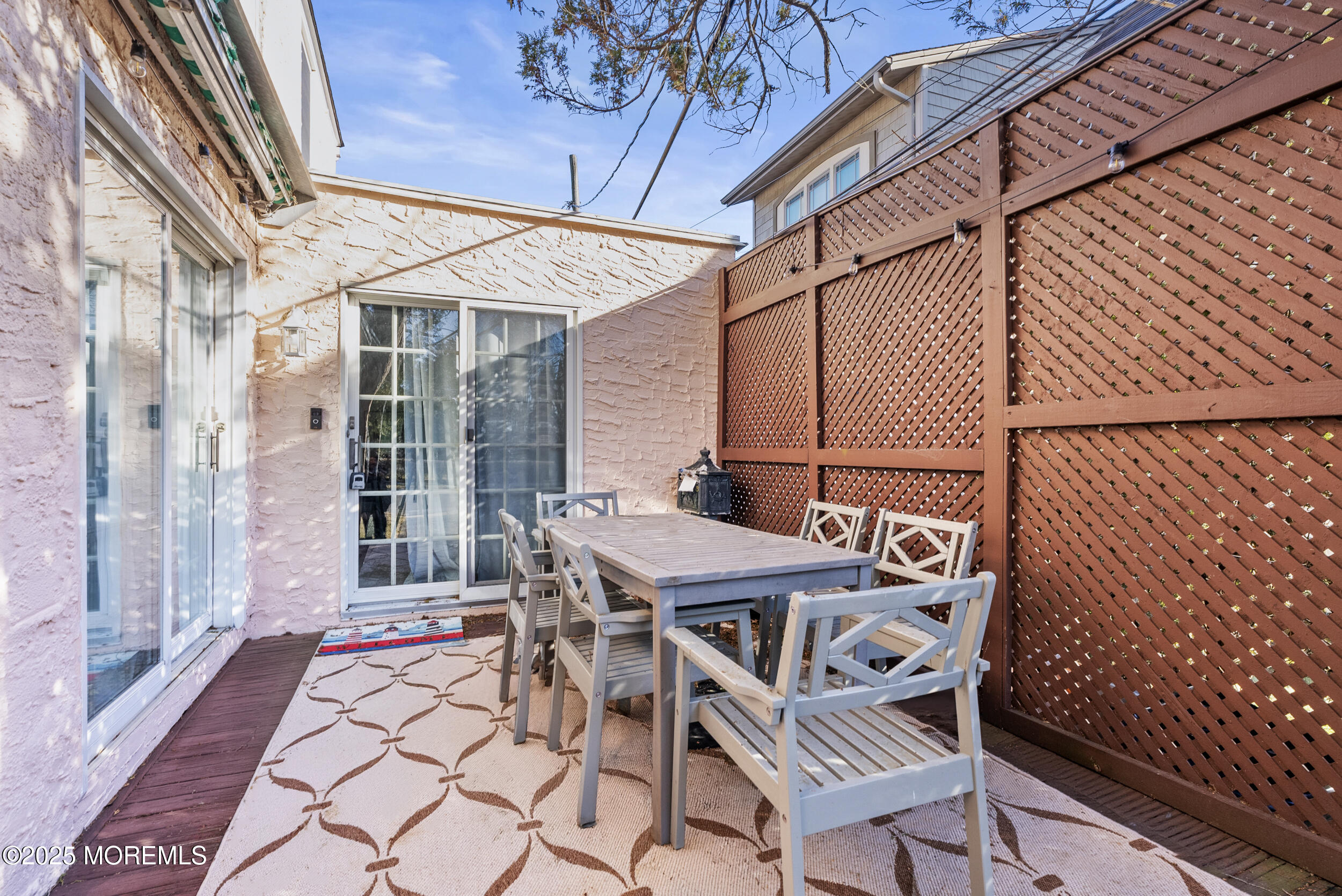 90 Deal Esplanade Deal, NJ 07723 - Photo 23 of 25 a patio with table and chairs