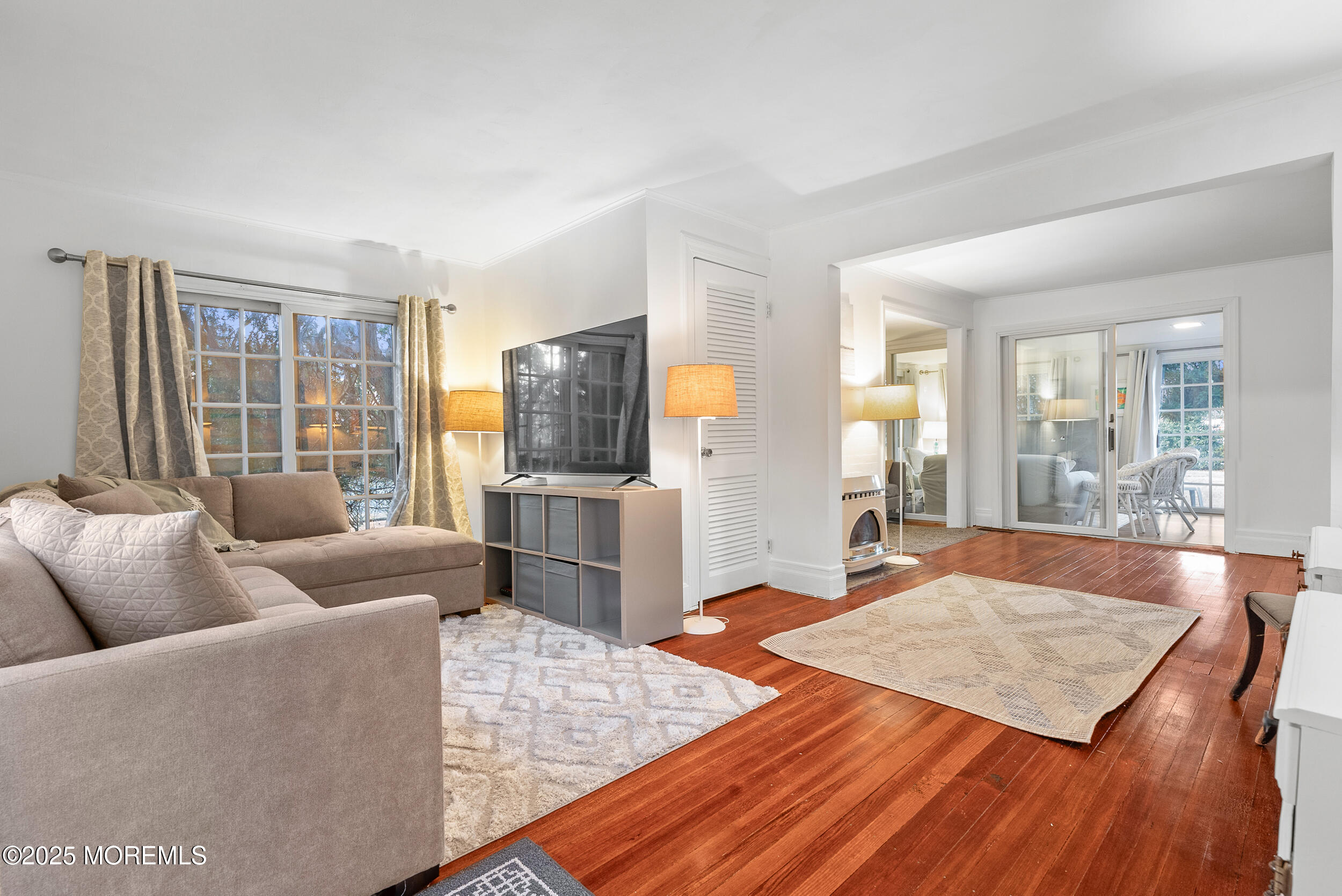 90 Deal Esplanade Deal, NJ 07723 - Photo 4 of 25 a living room with furniture and a flat screen tv